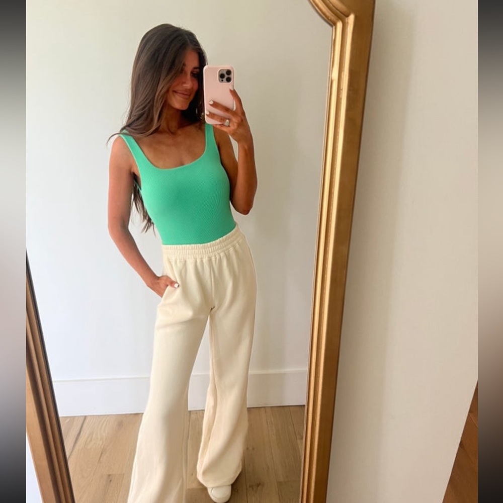 These three boutique green bodysuit